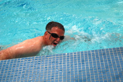Image: Swensen swims — Principal Swensen attacks the 300 meters of swimming.