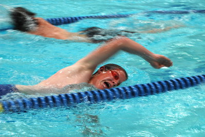 Image: Anzi Rhodes — Anzl Rhodes begins the swim for his individual triathlon.
