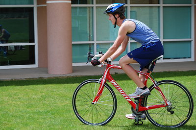 Image: Austin Reese — Austin Reese takes off on his bike for the 16 mile trek.