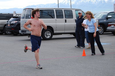 Image: Jacob Gregory — Jacob Gregory finishes his individual triathlon.