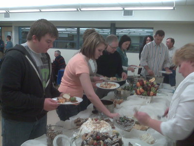 Image: Dessert looks good — Students look over the desserts at a Student of the Month luncheon late last year.