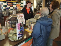 Image: Hester taking orders — Amanda Hester taking orders at Smithfield A&amp;W from Dietrich’s grandma, Donna Crosby (right) and her friend Gail Clayton (middle). On the counter is the donation jar with a picture of Dietrich on it. There were $719 in cash and checks dropped in the jar along with $2033 of profits donated by Smithfield A&amp;W.
