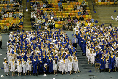 Image: Graduating Class of 2011 toss their caps in celebration