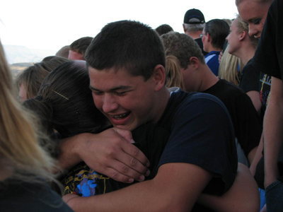 Image: Joe Orr, a baritone player, celebrates with hugs after the announcement that Sky View Marching Band had advanced to the 2011 BOA Finals.
