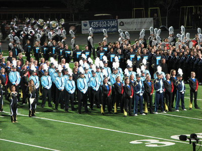 Image: Senior members of the Sky View Marching Band stand at attention during the presentation of awards for the 2011 Bands of America Championships.