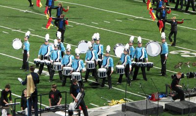 Image: The battery of  the Sky View Marching Band poses during the closer of their “Rock Me Blue” 2011 show in a St. George, Utah band competition.