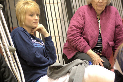 Image: Assistant Coach Hayley Hansen looks on after knee surgery to repair MCL