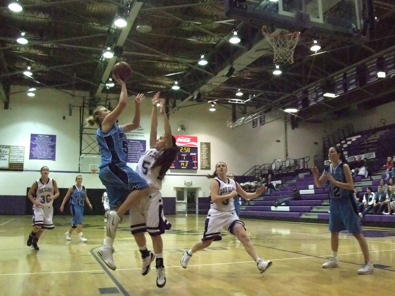 Image: Amy Andrus — Amy shoots for two of her 31 points of the game.