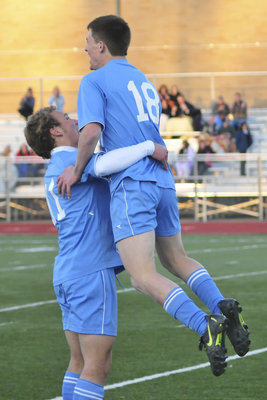 Image: Tanner Crockett — Tanner Crockett vaults off the shoulders of Riley Reeder after scoring a goal.