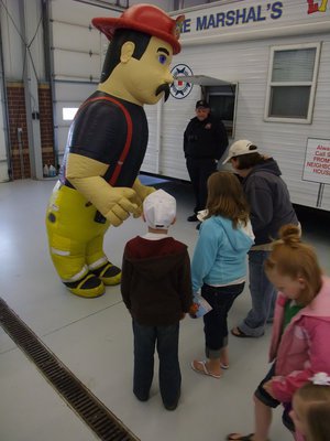 Image: A little scary — The inflated fireman scared a few of the tiny kids but the older kids loved him.