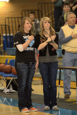 Image: Britteney Felix and Bailey Huskinson sing the National Anthem