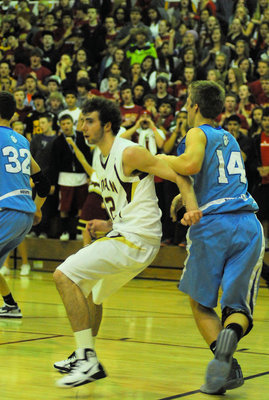 Image: Don Corbell (#14) — Looking for a pass down in the post