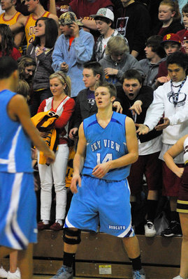 Image: Don Corbell (#14) — Getting the business from Logan High Fans
