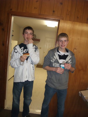 Image: Dewey and Low — Matt Dewey and Jake Low, youth council members, take a break after helping in the kitchen.
