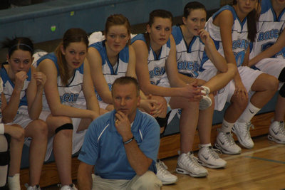 Image: Coach and Team — Coach Paul Hansen and the rest of the team watch the game — closely.