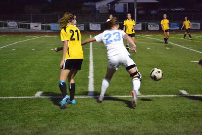 Image: Jessica Brooksby battles off Roy defender.