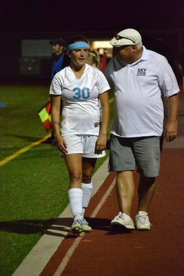Image: Coach Geddes talks to Stacy Bair as she comes off the field.